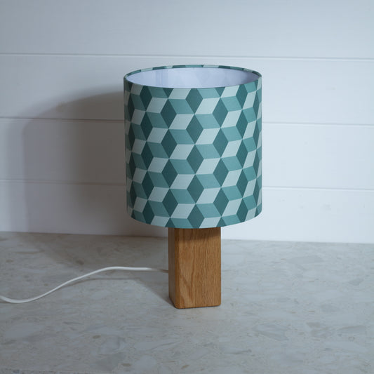 Green Cubes Geometric Print Lampshade on a Hardwood Table Lamp