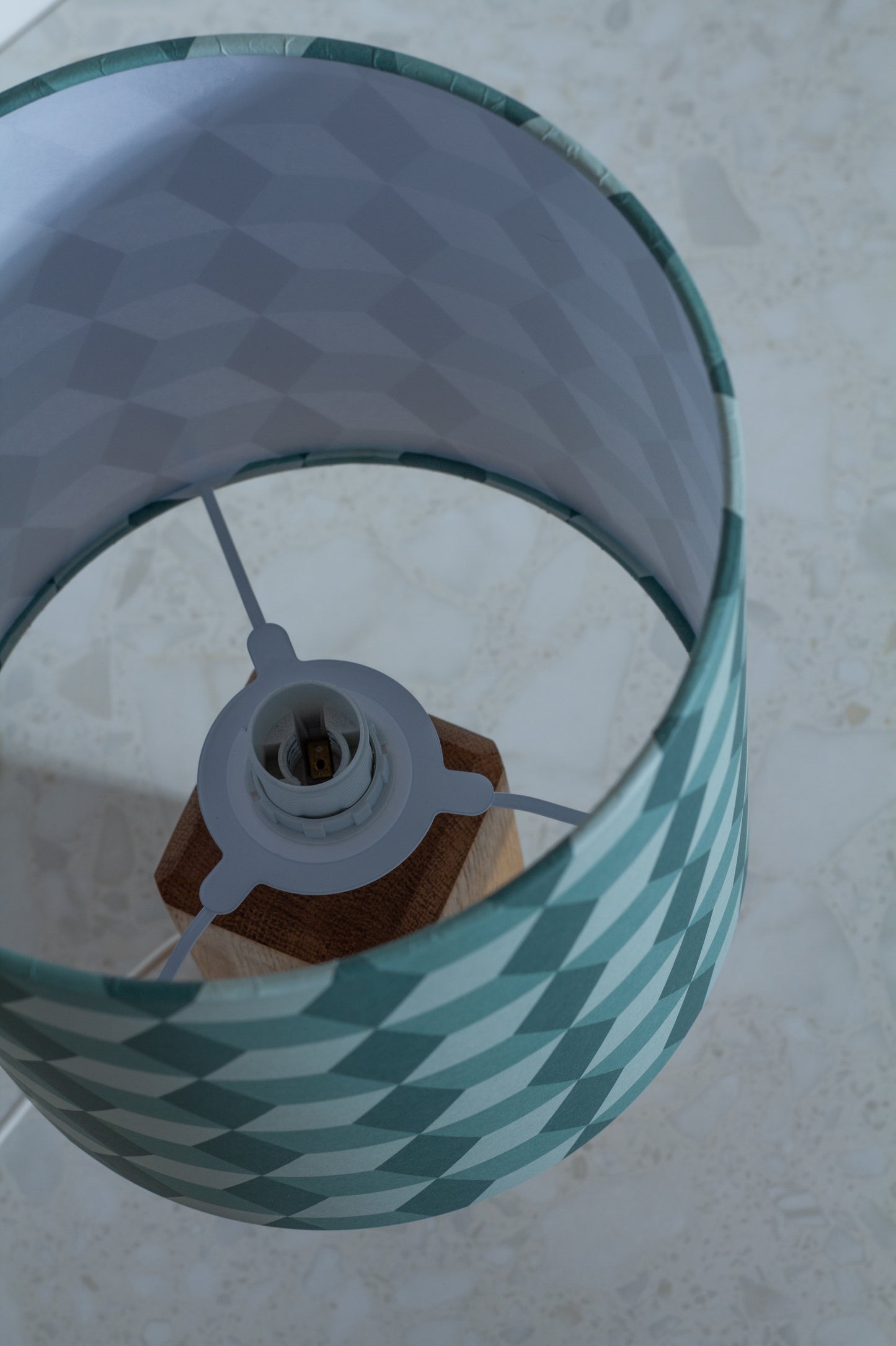 Green Cubes Geometric Print Lampshade on a Hardwood Table Lamp