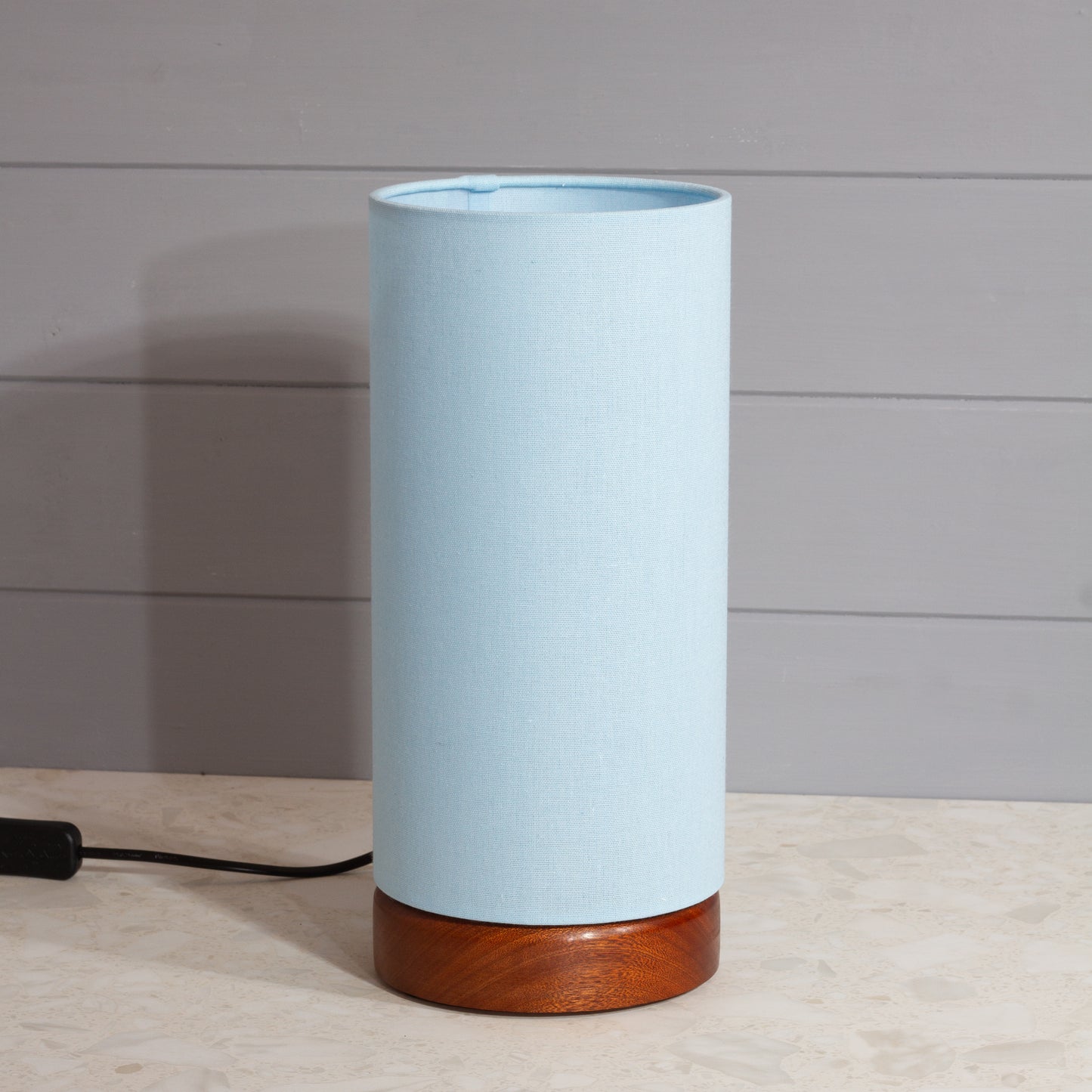 Round Sapele Table Lamp (15cm) with 15cm x 30cm Drum Lampshade in F190 ~ Baby Blue Linen