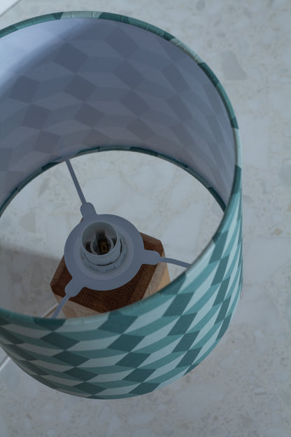 Green Cubes Geometric Print Lampshade on a Hardwood Table Lamp