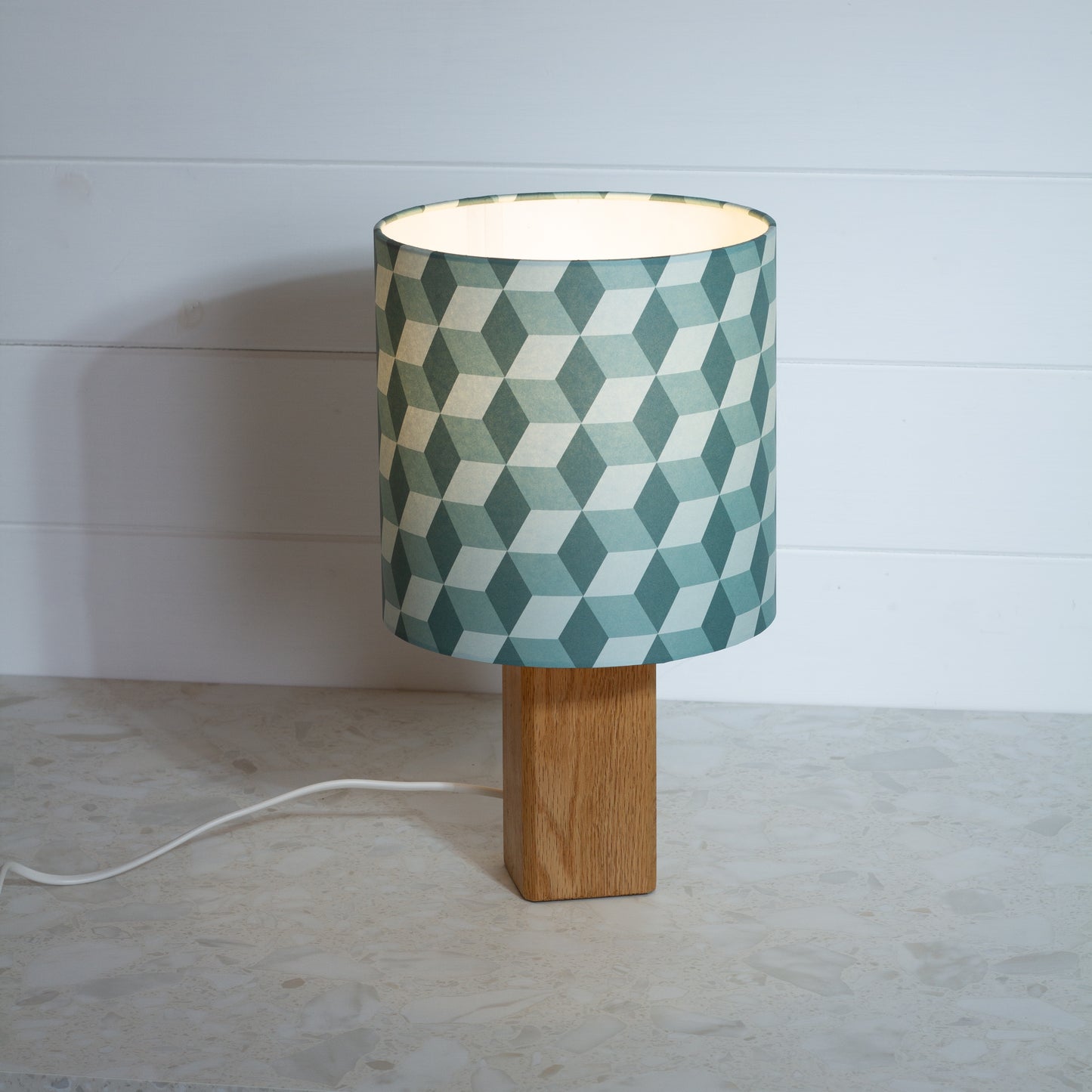 Green Cubes Geometric Print Lampshade on a Hardwood Table Lamp