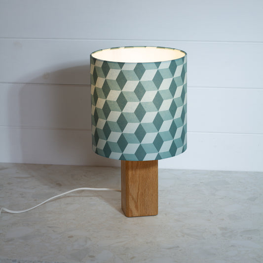 Green Cubes Geometric Print Lampshade on a Hardwood Table Lamp