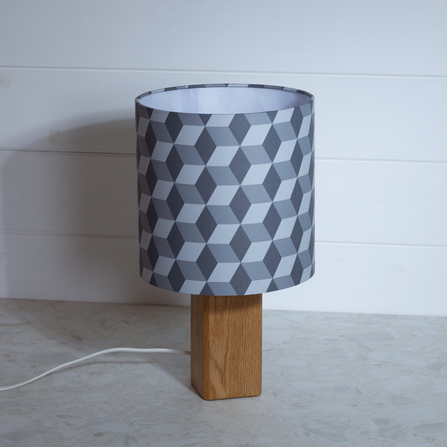 Grey Cubes Geometric Print Lampshade on a Hardwood Table Lamp