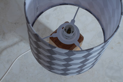 Grey Cubes Geometric Print Lampshade on a Hardwood Table Lamp