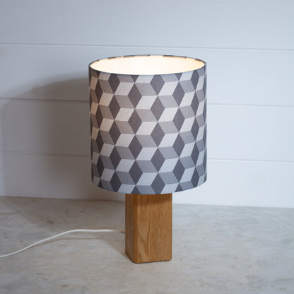 Grey Cubes Geometric Print Lampshade on a Hardwood Table Lamp