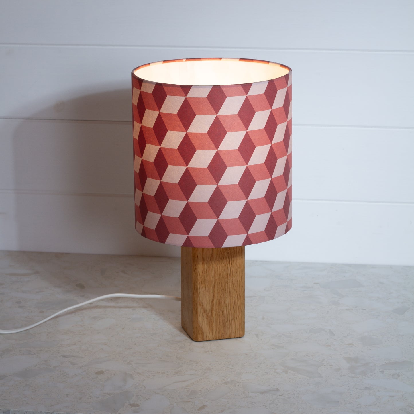 Red Cubes Geometric Print Lampshade on a Hardwood Table Lamp