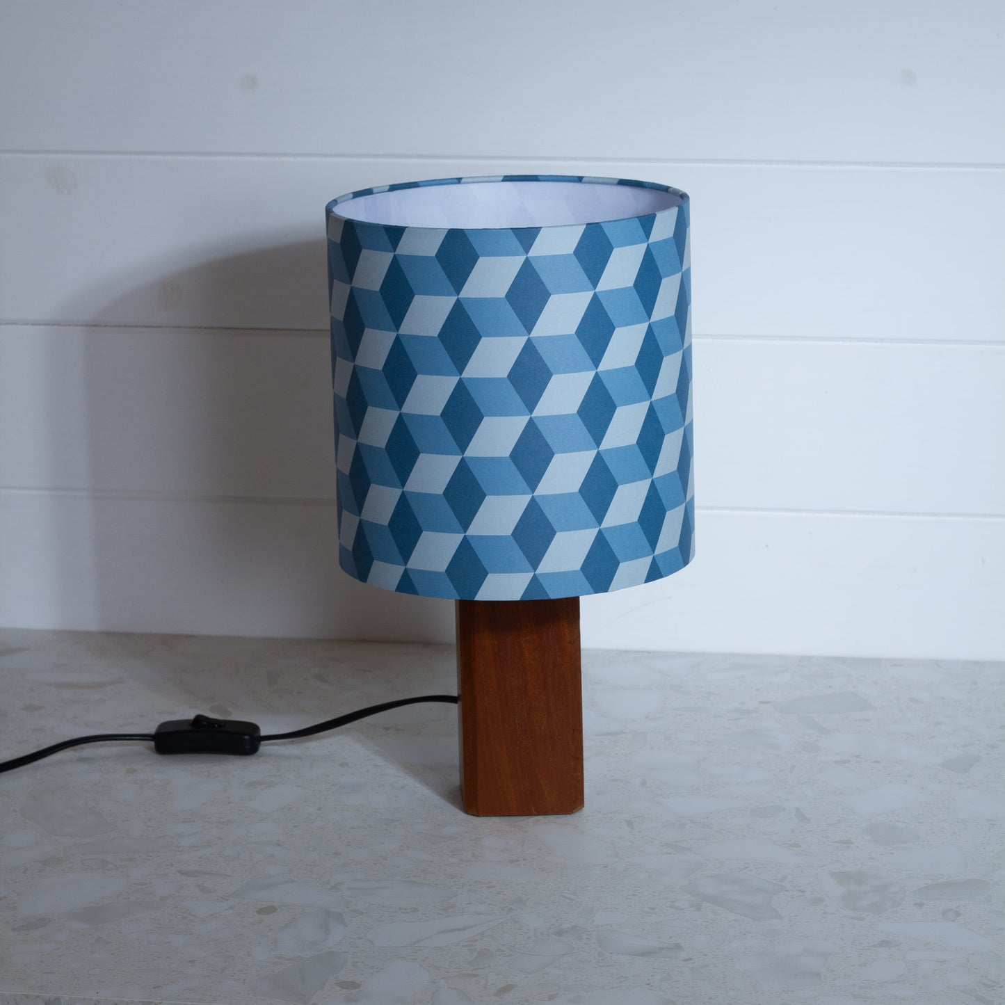 Blue Cubes Geometric Print Lampshade on a Hardwood Table Lamp