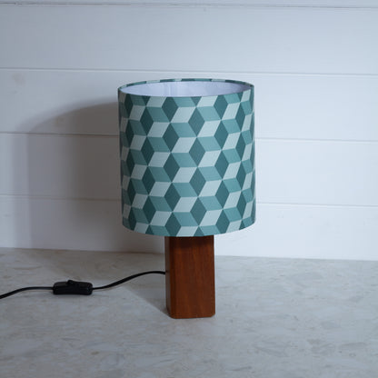 Green Cubes Geometric Print Lampshade on a Hardwood Table Lamp