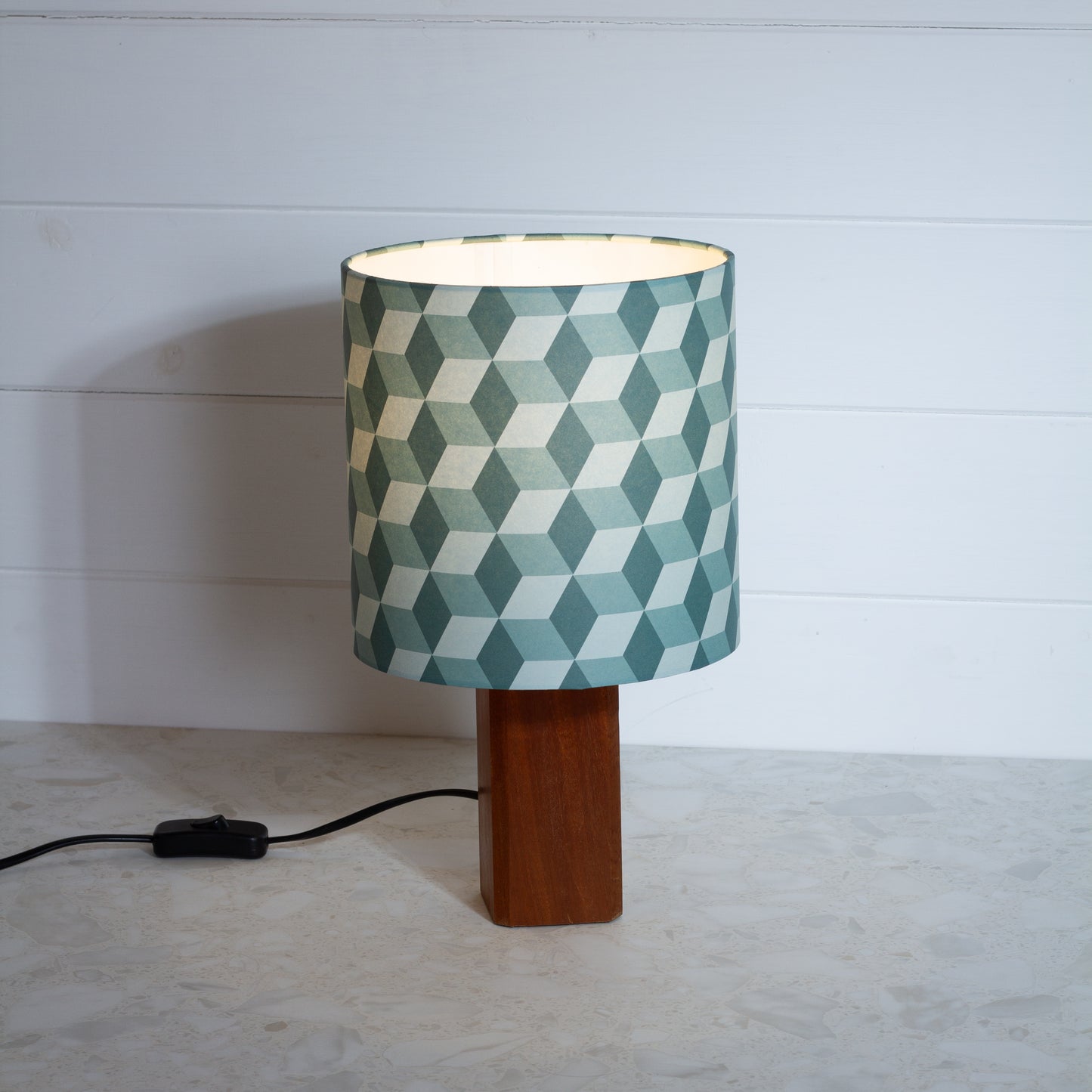 Green Cubes Geometric Print Lampshade on a Hardwood Table Lamp