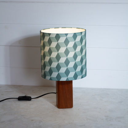 Green Cubes Geometric Print Lampshade on a Hardwood Table Lamp