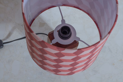 Red Cubes Geometric Print Lampshade on a Hardwood Table Lamp