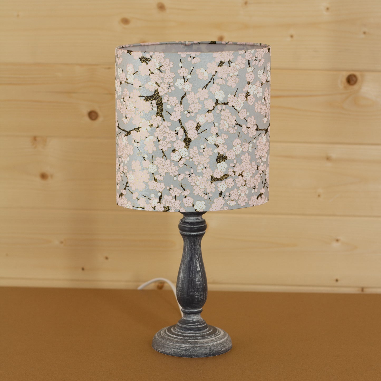 Paros Wooden Table Lamp with a Oval Shade in W02 ~ Pink Cherry Blossom on Grey
