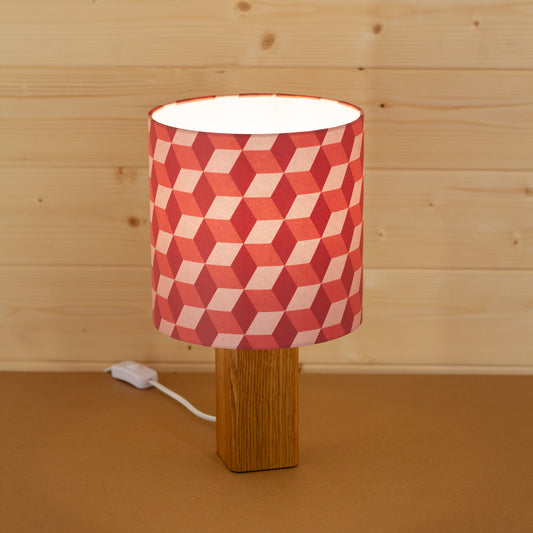 Red Cubes Geometric Print Lampshade on a Hardwood Table Lamp