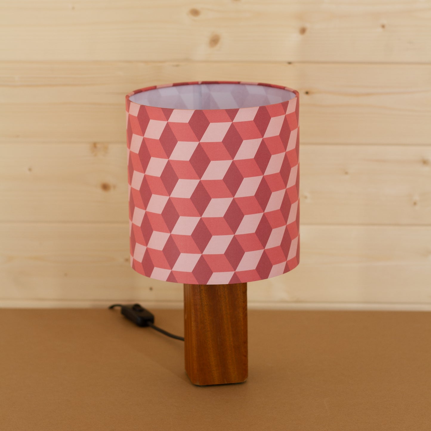 Red Cubes Geometric Print Lampshade on a Hardwood Table Lamp