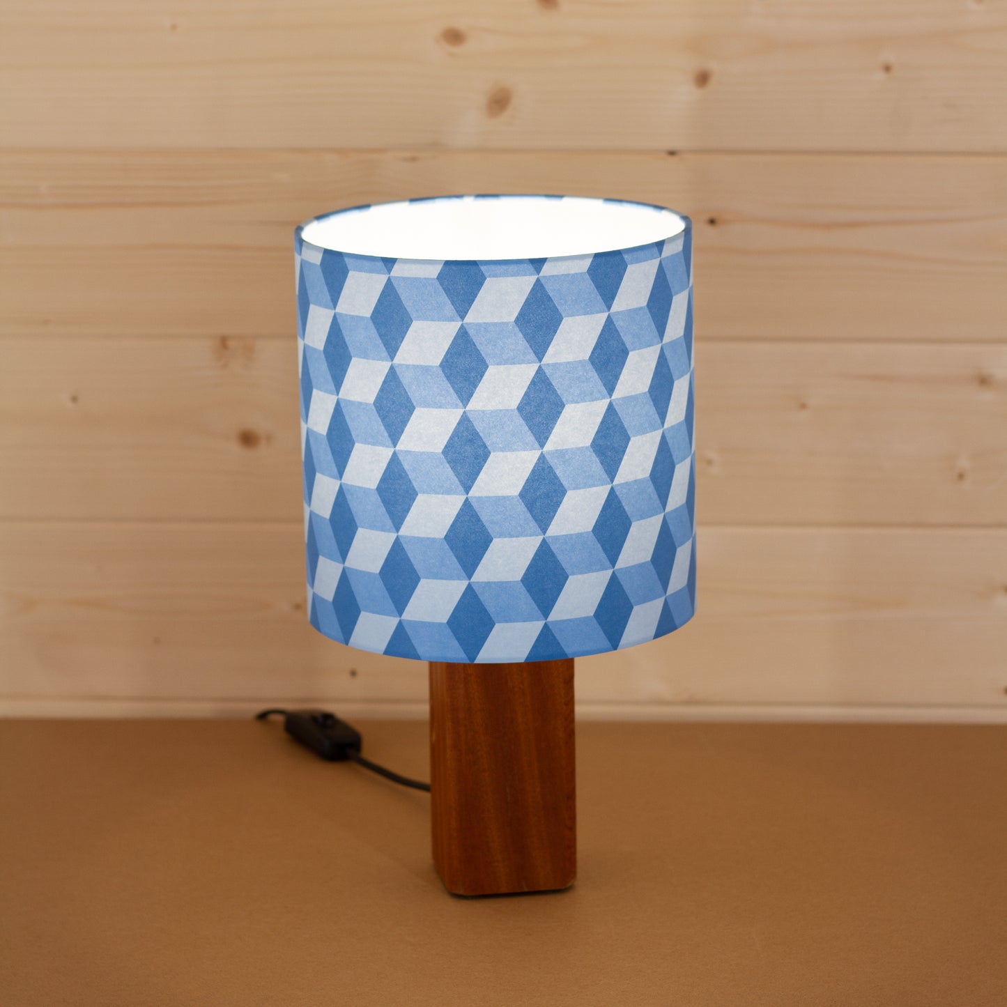 Blue Cubes Geometric Print Lampshade on a Hardwood Table Lamp