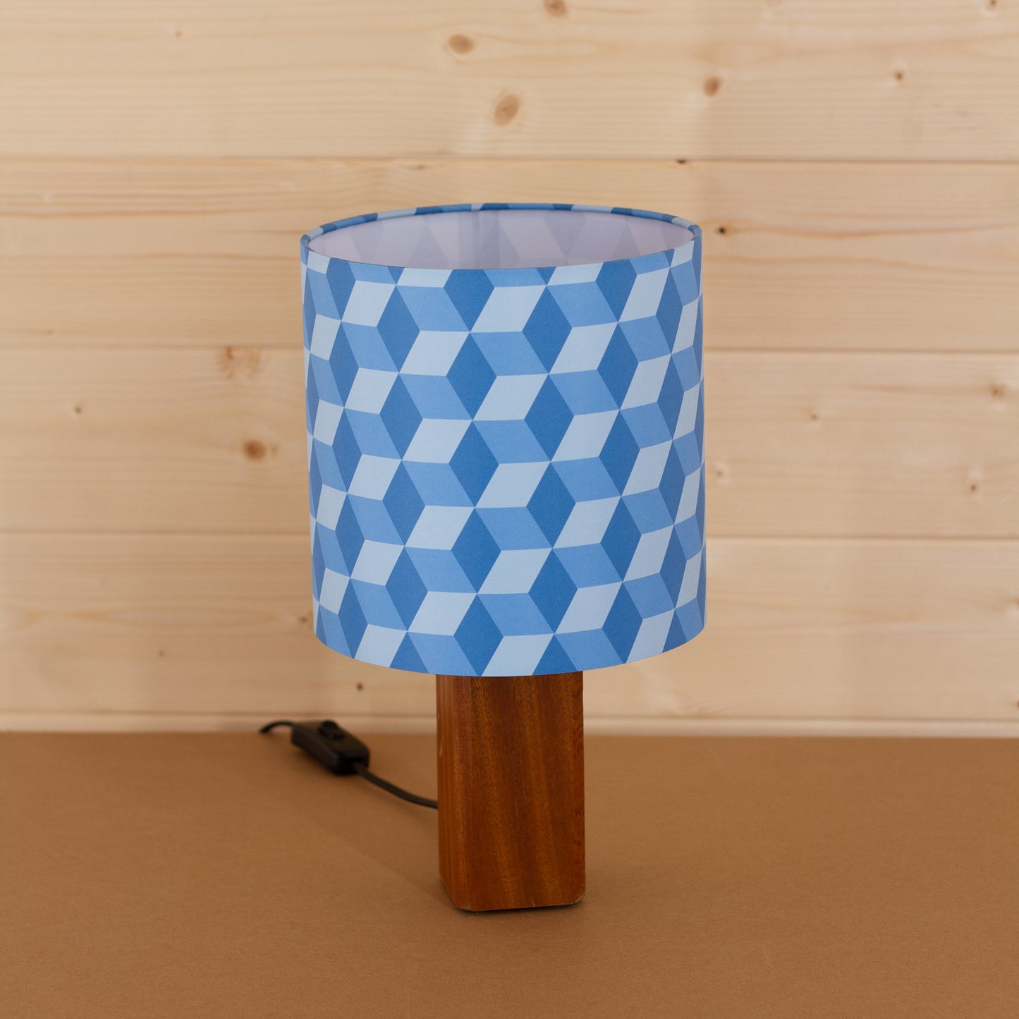 Blue Cubes Geometric Print Lampshade on a Hardwood Table Lamp