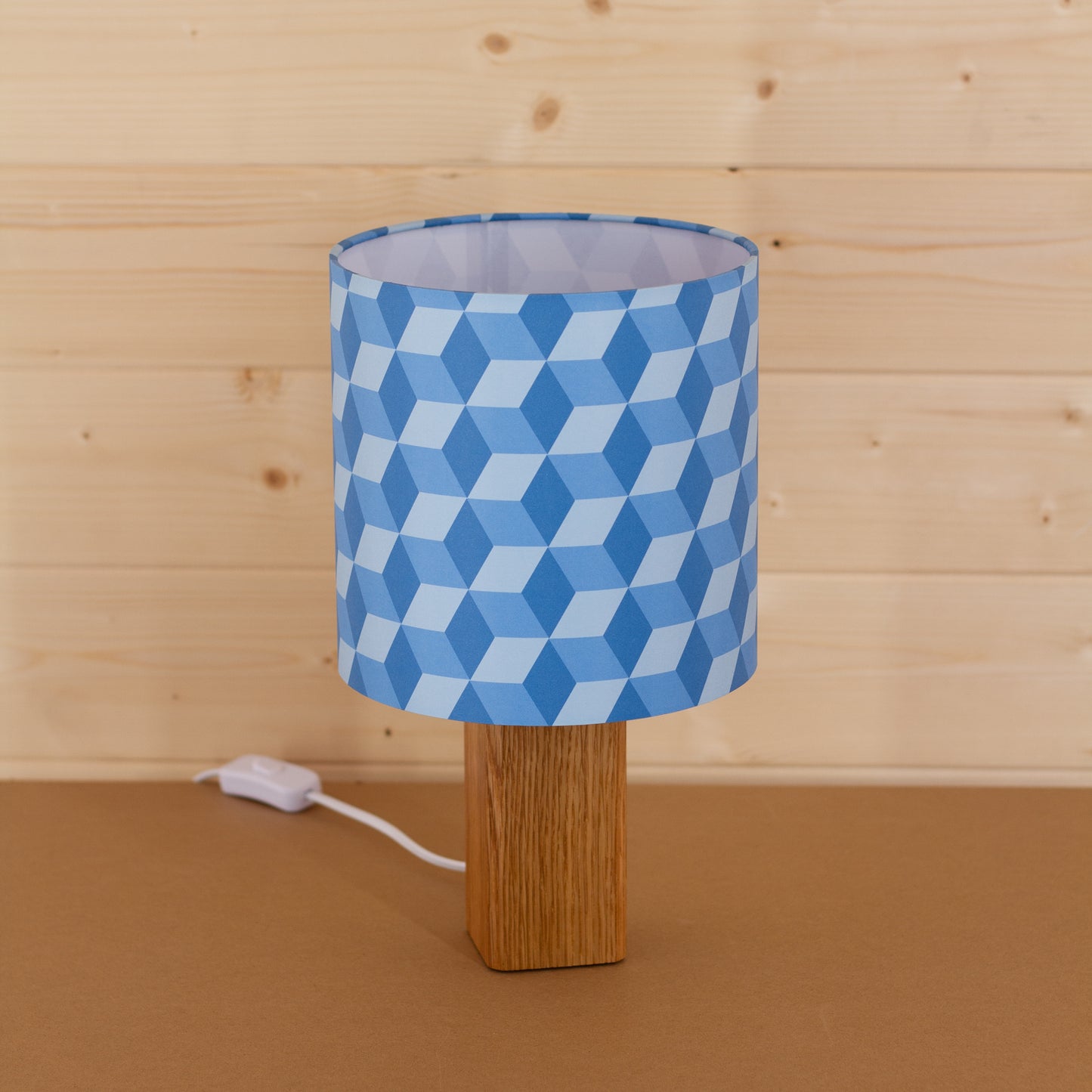 Blue Cubes Geometric Print Lampshade on a Hardwood Table Lamp